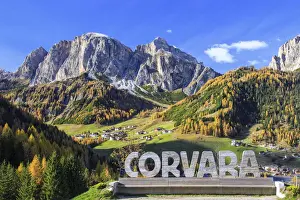 Sella Group Prints: The colorful woods frame the village of Corvara and the high peaks at Badia Valley