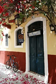Aged Gallery: Colourful alleyway and entrance to Taverna Larenzo, Rethymnon Old Town, Crete, Greece