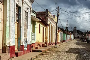 Trinidad Prints: Colourful colonial houses on a cobbled street in the historic centre of Trinidad