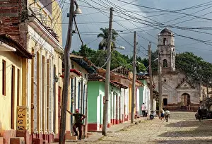 Trinidad Prints: Colourful colonial houses on a cobbled street in the historic centre of Trinidad