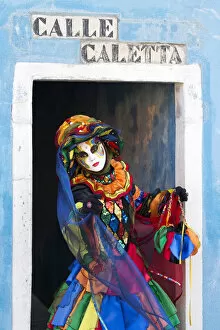 Colourful costume worn during the Venice Carnival on the island of Burano, Venice