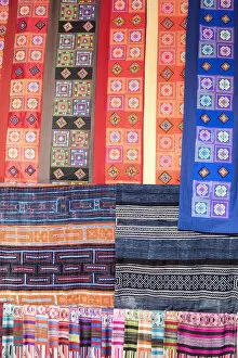 Colourful fabrics hanging in a market, Sapa; Sa Pa District; Lao Cai Province; Vietnam