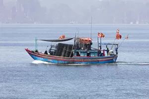 Colourful fishing boat with flags, Halong Bay, Quang Ninh Province, North-East Vietnam