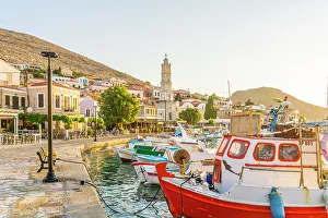 Images Dated 10th January 2023: The colourful harbour and Saint Nicholas church in the background, Halki, Chalki