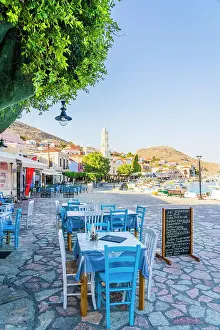 The colourful harbour and Saint Nicholas church in the background, Halki, Chalki, Dodecanese Islands, Greece