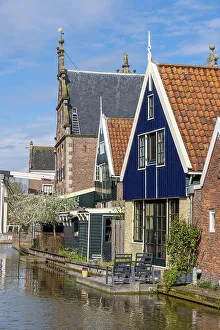 Colourful houses line the canal in the village of De Rijp, North Holland, Netherlands