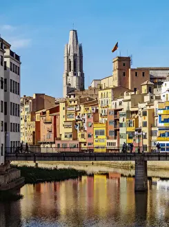 Colourful houses and Sant Feliu Basilica reflecting in the Onyar River, Girona or Gerona
