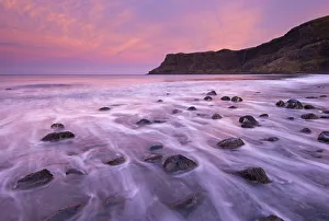 November Prints: Colourful pink sunrise above Talisker Bay, Isle of Skye, Scotland, UK