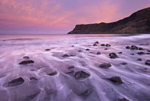 Colourful pink sunrise above Talisker Bay, Isle of Skye, Scotland, UK
