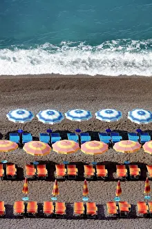 Positano Prints: Colourful sunbeds and parasols on the beach