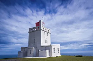 Light Houses Collection: Concrete Dyrholaey Lighthouse against cloudy sky at Dyrholaey, South Iceland, Iceland