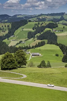 Images Dated 29th July 2014: Convertible car on winding road in the Emmental Valley, Berner Oberland, Switzerland