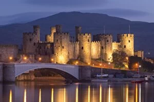 Conwy Castle illuminated at night, Conwy, Wales. Spring (May) 2017