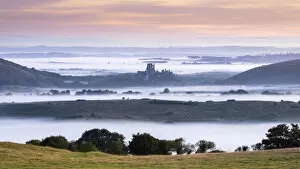 Corfe Castle at dawn, Isle of Purbeck, Dorset, England, UK