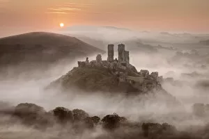 Images Dated 11th December 2020: Corfe Castle at dawn surrounded by mist, Dorset, England