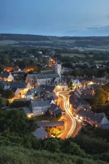 Corfe Castle village at dusk viewed from East Hill, Dorset, England, UK Corfe Castle village at dusk viewed from East Hill, Dorset, England, UK