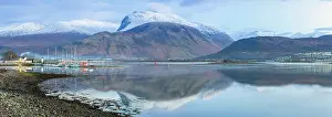 Hillside Prints: Corpach lighthouse and marina on the shores of Loch Eli with snow capped Ben Nevis and Fort William