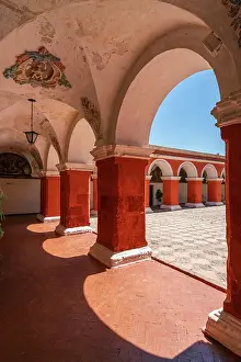 Pillar Prints: Corridor with red walls and columns at Monastery of Santa Catalina de Siena
