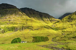 A Charnaich Collection: Cottage in Glencoe valley under mountains, Glencoe, Scottish Highlands, Scotland, UK