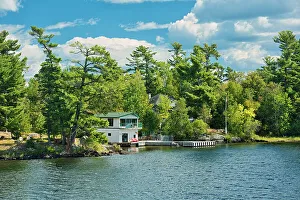Kenora Prints: Cotttage and boathouse on Lake of the Woods Kenora, Ontario, Canada