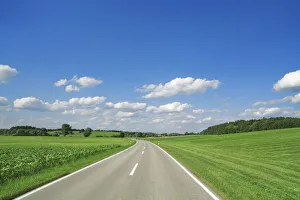 Countryside street and cumulonimbus clouds - Germany, Bavaria, Upper Bavaria