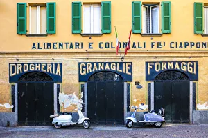 Images Dated 30th August 2018: Couple of Lambretta Innocenti scooter parked at the old grocery, Morbegno, province