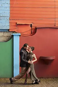 A couple of Professional Tango dancers in the colorful Caminito de la Boca, Buenos Aires, Argentina. (MR)