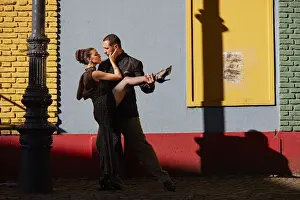 A couple of Professional Tango dancers in the colorful Caminito de la Boca, Buenos Aires, Argentina. (MR)