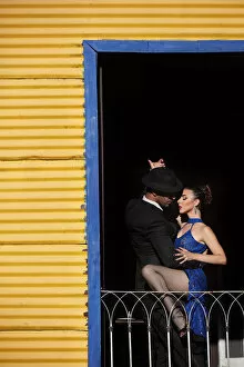 Performance Gallery: A couple of Professional Tango dancers inside a colorful house of La Boca, Buenos Aires