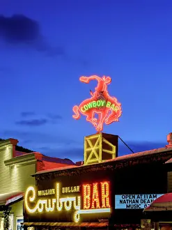 Neon Sign Prints: Cowboy Bar Illuminated at Night, Neon Sign Jackson Hole, Wyoming, USA