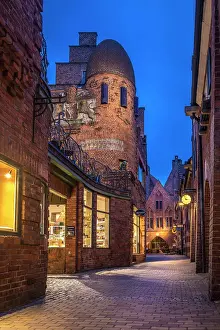Federal State Prints: Craftsman`s yard in the illuminated Boettcherstrasse in the evening, Bremen, Germany