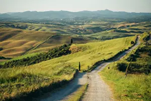 Winding Road Prints: Crete Senesi, Tuscany, Italy: Winding road through rolling hills and farmland