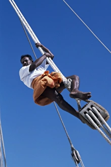 One of the crew members ofs / Y Sanjeeda up the rigging