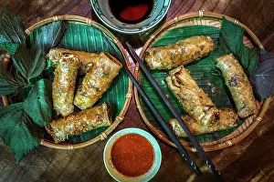 Restaurants Prints: Crispy spring rolls served on bamboo trays, Vietnam