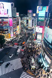 Crossing Prints: Crowds cross Shibuya Crossing, Tokyo, at night, illuminated by bright billboards