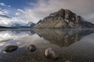 Images Dated 20th July 2017: Crowfoot mountain reflection in the mirror still waters of Bow Lake, Banff National Park