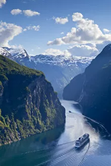 Images Dated 17th November 2010: A Cruise Ship navigates through a bend in the dramatic Geiranger Fjord, Geiranger