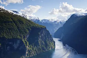 A Cruise Ship navigates through a bend in the dramatic Geiranger Fjord, Geiranger