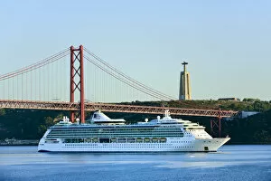 Images Dated 2nd December 2016: A cruise ship in the Tagus river, leaving the port of Lisbon, passes beneath the 25