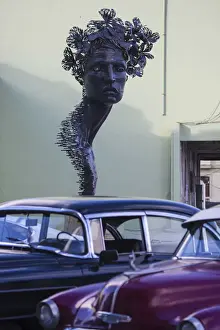 American Car Prints: Cuba, Havana, The Malecon, Classic America cars infront of statue