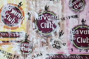 Cuba Prints: Cuba, Trinidad, Havana Club painted on wall of bar in historical center