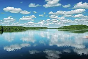 Reflected Prints: cumulus clouds reflected in Kenogamisis Lake Geraldton, Ontario, Canada
