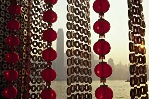 A curtain of Chinese New Year decorations frame a view