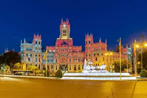 Cybele Palace or Palacio de Cibeles city hall illuminated by colors of Spanish flag