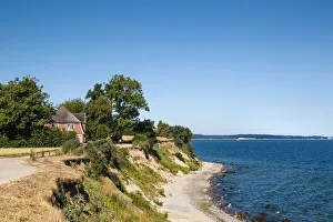 Cyclist at cliff Brodtener Ufer, Niendorf, Baltic coast, Schleswig-Holstein, Germany