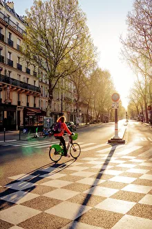 Images Dated 9th February 2023: Cyclist at dawn on the deserted streets of Paris, France