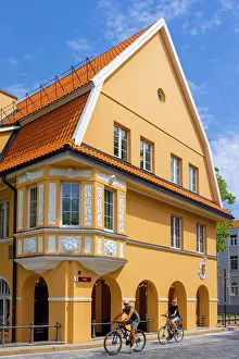 Cyclists Prints: Cyclists infront of Traditional Buildings, Klaipeda, Lithuania