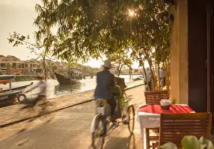 Table Prints: Cyclos passing restaurant, Hoi An (UNESCO World Heritage Site), Quang Ham, Vietnam