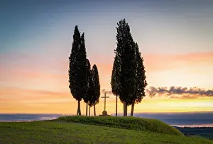 Val Dorcia Prints: Cypress trees and cross at sunrise