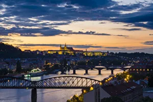 Czech Republic, Prague. Prague Castle, Pazsky Hrad, and the Vltava River at sunset